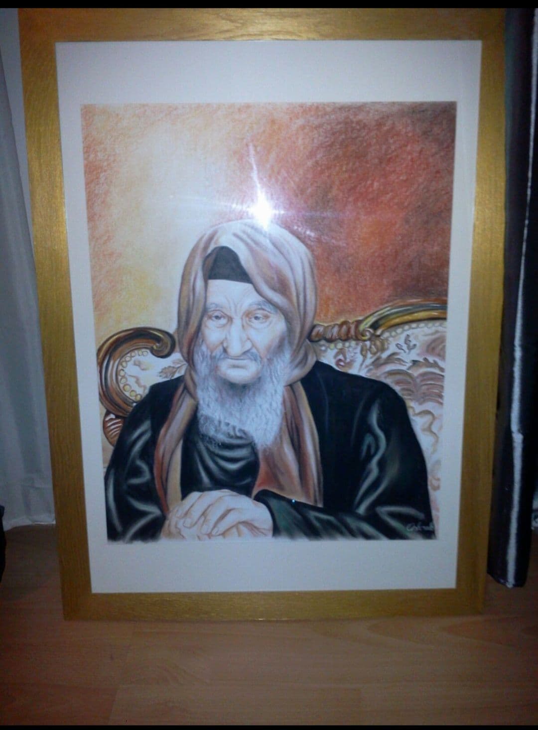 Portrait du Baba Salé dans un cadre doré avec passe-partout blanc